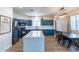 Modern kitchen with blue cabinets, white countertops, and stainless steel appliances at 14760 W Riviera Dr, Surprise, AZ 85379