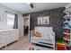 Adorable Bedroom with crib, dresser, and playful decor at 14760 W Riviera Dr, Surprise, AZ 85379