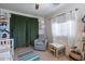 Cozy bedroom with comfy chair, desk, and large windows at 14760 W Riviera Dr, Surprise, AZ 85379