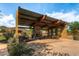 Relaxing community patio with a fireplace and seating at 1860 W Buckhorn Trl, Phoenix, AZ 85085