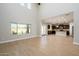 Spacious living room with high ceilings and views into the kitchen area at 1860 W Buckhorn Trl, Phoenix, AZ 85085