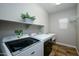 Laundry room with washer, dryer, and utility sink at 1860 W Buckhorn Trl, Phoenix, AZ 85085