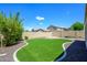 Artificial turf backyard with landscaped border at 1860 W Buckhorn Trl, Phoenix, AZ 85085