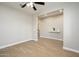 Spacious bedroom with ceiling fan and access to bathroom at 1860 W Buckhorn Trl, Phoenix, AZ 85085