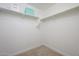 Bright walk-in closet with ample shelving and hanging space at 1860 W Buckhorn Trl, Phoenix, AZ 85085