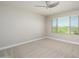 Bright bedroom with neutral walls, carpet flooring, and large window at 1860 W Buckhorn Trl, Phoenix, AZ 85085