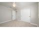 Spacious bedroom featuring a double door closet and neutral decor at 1860 W Buckhorn Trl, Phoenix, AZ 85085