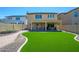 Artificial turf backyard with covered patio and walkway at 1860 W Buckhorn Trl, Phoenix, AZ 85085