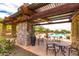 Relaxing pool area with covered seating and tables at 1860 W Buckhorn Trl, Phoenix, AZ 85085