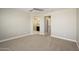Spacious bedroom with ceiling fan and en-suite bathroom access at 1860 W Buckhorn Trl, Phoenix, AZ 85085