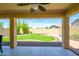 Covered patio overlooking a landscaped backyard with artificial turf at 1860 W Buckhorn Trl, Phoenix, AZ 85085