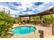 Inviting spa with seating and mountain views at 1860 W Buckhorn Trl, Phoenix, AZ 85085