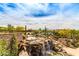 Stunning waterfall feature with walking paths and landscaping at 1860 W Buckhorn Trl, Phoenix, AZ 85085