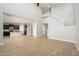 Open living space with high ceilings, hardwood floors, and a view of the kitchen at 1860 W Buckhorn Trl, Phoenix, AZ 85085