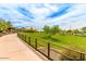 Paved path with railings leading to a grassy area at 1860 W Buckhorn Trl, Phoenix, AZ 85085