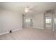 Spacious loft area with ceiling fan and access to bedrooms at 1860 W Buckhorn Trl, Phoenix, AZ 85085