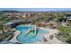 Community pool with water features and a play area at 1860 W Buckhorn Trl, Phoenix, AZ 85085