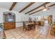 Dining room features wood table and chairs near kitchen at 11007 E Vecino St, Chandler, AZ 85248