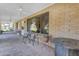 Relaxing covered porch with seating and potted plants at 11007 E Vecino St, Chandler, AZ 85248