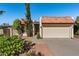 Single story house with a two-car garage and mature landscaping at 2501 E Pepper Ridge Cir, Phoenix, AZ 85032