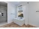 Spa-like bathroom with soaking tub, walk-in shower, and neutral tile at 18888 E Apricot Ln, Queen Creek, AZ 85142