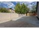 Side yard with concrete, storage shed, and block wall at 2930 E Leland St, Mesa, AZ 85213