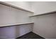 Walk-in closet with wood shelving and hanging rods at 2930 E Leland St, Mesa, AZ 85213