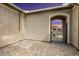 Private courtyard with tile flooring and a wrought iron gate at 19039 N 264Th Ave, Buckeye, AZ 85396