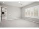 Bedroom with view into the kitchen and large windows at 19039 N 264Th Ave, Buckeye, AZ 85396