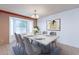Bright dining room featuring a table with seating for six and a bay window at 1023 E Escuda Dr, Phoenix, AZ 85024