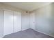 Bright bedroom with double door closet and neutral carpeting at 1023 E Escuda Dr, Phoenix, AZ 85024