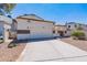 Front view of a charming two-story home with a two-car garage at 1023 E Escuda Dr, Phoenix, AZ 85024