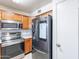 Modern kitchen features stainless steel appliances and ample wood cabinets at 1023 E Escuda Dr, Phoenix, AZ 85024