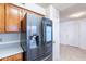 Kitchen with stainless steel refrigerator and wood cabinets at 1023 E Escuda Dr, Phoenix, AZ 85024