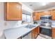 Bright kitchen boasts stainless steel appliances and light gray countertops at 1023 E Escuda Dr, Phoenix, AZ 85024