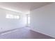 Well-lit bedroom with window and neutral colored carpet at 1023 E Escuda Dr, Phoenix, AZ 85024