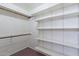 Walk-in closet with double hanging rods and shelving at 1023 E Escuda Dr, Phoenix, AZ 85024