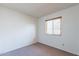 Bedroom with window, blinds, and neutral carpet at 1023 E Escuda Dr, Phoenix, AZ 85024
