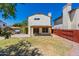 Large backyard with grassy area, hot tub, and wooden fence at 1023 E Escuda Dr, Phoenix, AZ 85024