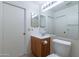 Bathroom boasts a vanity with sink, toilet and mirror at 1023 E Escuda Dr, Phoenix, AZ 85024
