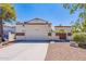 Front view of a charming two-story home with a two-car garage at 1023 E Escuda Dr, Phoenix, AZ 85024