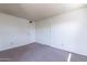Spacious bedroom featuring neutral walls and carpet at 1023 E Escuda Dr, Phoenix, AZ 85024