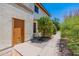 Side yard with a walkway and access to a storage area at 1023 E Escuda Dr, Phoenix, AZ 85024