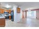 Kitchen and dining area with tile floors and a barn door at 1023 E Escuda Dr, Phoenix, AZ 85024