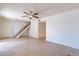 Bright living room with tile floors and staircase at 1023 E Escuda Dr, Phoenix, AZ 85024
