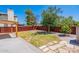 Landscaped backyard with flagstone path and wooden fence at 1023 E Escuda Dr, Phoenix, AZ 85024