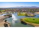 Aerial view of a beautiful community with a lake, fountain, and golf course at 19661 N Echo Rim Dr, Surprise, AZ 85387