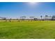 View of community driving range with golfers practicing at 19661 N Echo Rim Dr, Surprise, AZ 85387