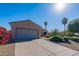 House exterior with driveway and landscaping at 19661 N Echo Rim Dr, Surprise, AZ 85387