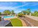 Landscaped backyard with artificial turf and a pool at 15234 N 19Th Pl, Phoenix, AZ 85022